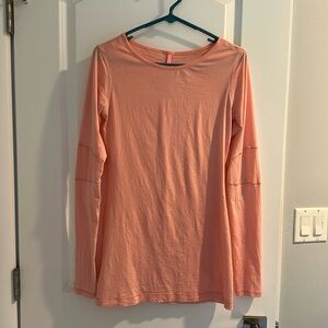 Like brand new Lululemon long sleeve light pink top! Size 6.